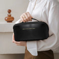 Portable travel makeup bag with comfortable handle grip


