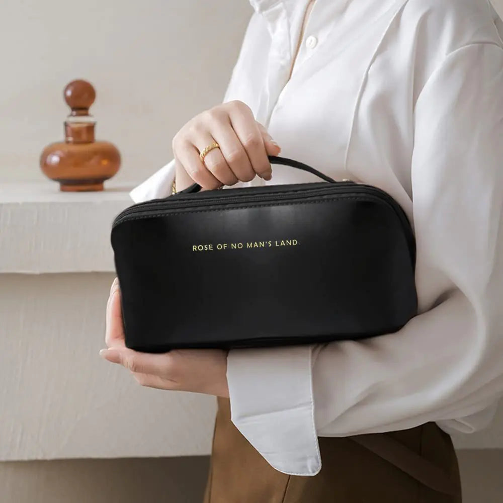 Portable travel makeup bag with comfortable handle grip

