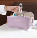 Side profile of double-layer cosmetic pouch with two compartments

